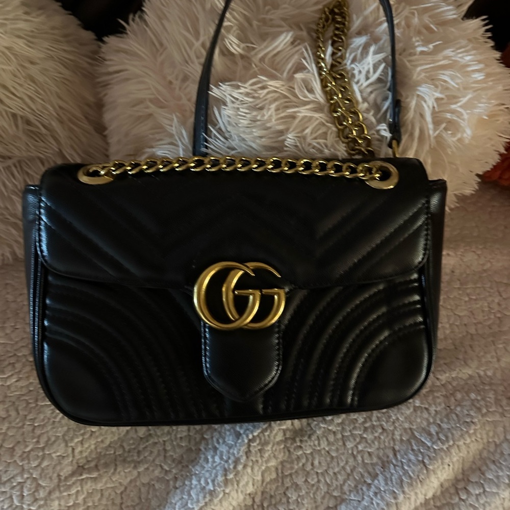 Gifted Gucci Bag in mint condition used one , smoke free home